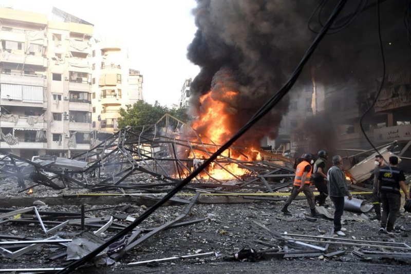Smoke and fire rise after an Israeli airstrike targeting Hezbollah weapons in Dahieh, southern Beirut, Lebanon, on Sunday. The attack destroyed a hangar and damaged nearby buildings and vehicles, according to Lebanese state media. Photo by Wael Hamzeh/EPA-EFE