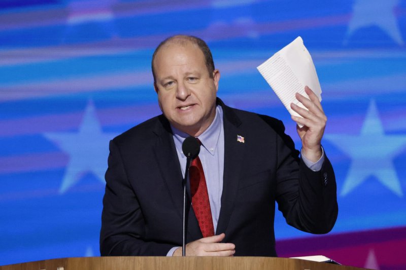 Colorado Gov. Jared Polis holds a page from conservative blueprint Project 2025 as he speaks at the 2024 Democratic National Convention at the United Center in Chicago, in 2024. File photo by Tannen Maury/UPI