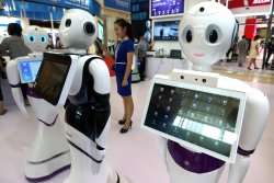 Robotic runners hobbled by breakdowns in first half-marathon against humans